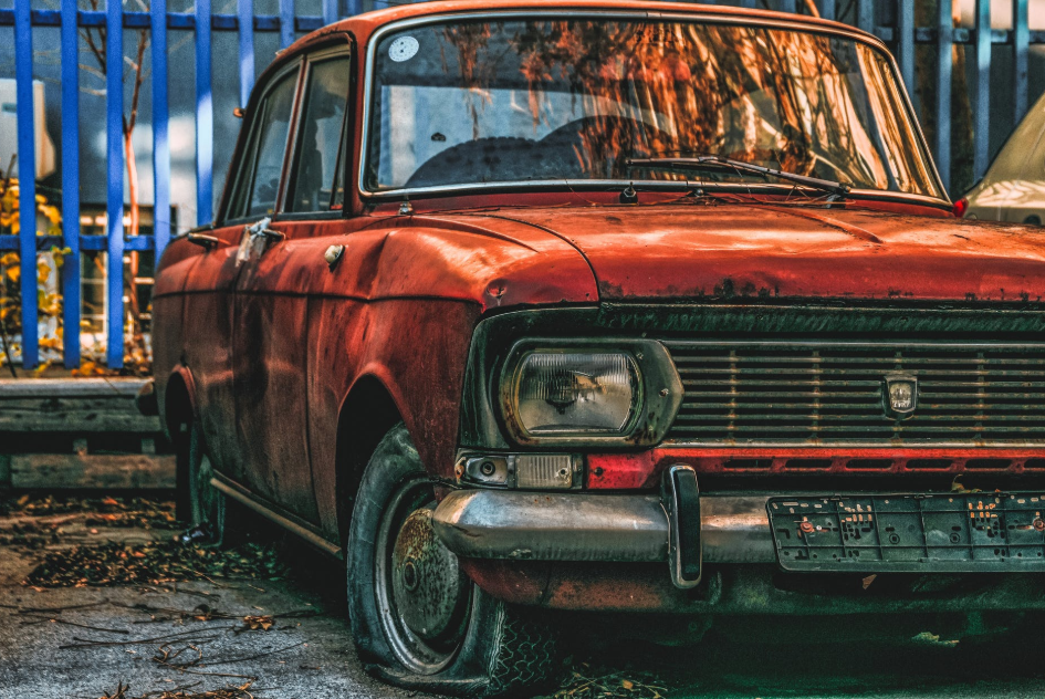 parked red junk car